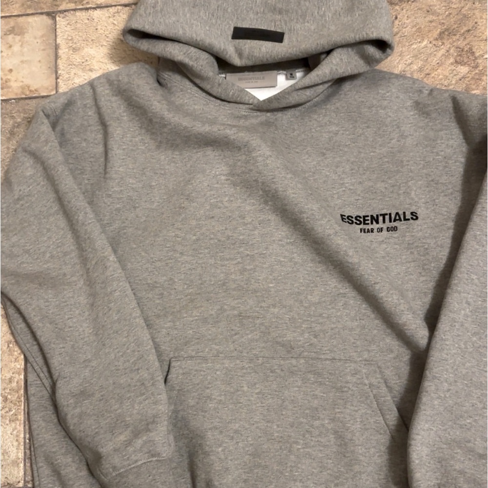 Grey essentials hoodie 
Size M